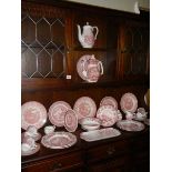 A large lot of red and white dinnerware, variety of makers including Mason's, Meakin, Johnson Bros.