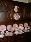 A large lot of red and white dinnerware, variety of makers including Mason's, Meakin, Johnson Bros.