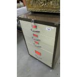 A filing cabinet with keys.
