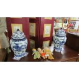 A pair of large blue and white Chinese lidded pots.