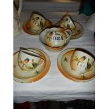 14 pieces of Victorian tea ware decorated with birds.