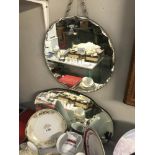 2 1930's bevel edge mirrors. Sizes 40.5cm diameter and 56cm x 33.