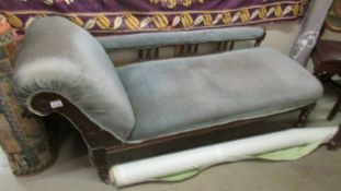 A Victorian mahogany chaise longue.