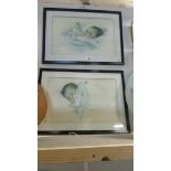 A pair of framed and glazed baby prints.