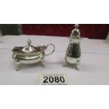 A Mappin and Webb sterling silver mustard and pepper pot, Birmingham 1954.