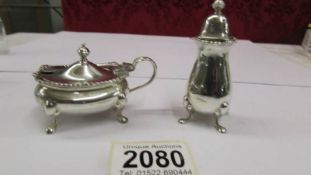 A Mappin and Webb sterling silver mustard and pepper pot, Birmingham 1954.