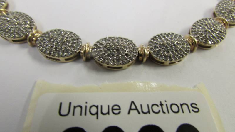 A 9ct gold and diamond bracelet. - Image 4 of 4