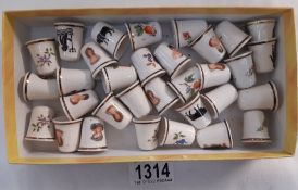 A box of decorative bone china thimbles
