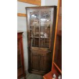 A good oak corner cabinet with linen fold bottom door.
