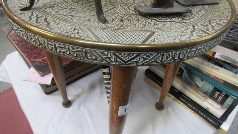 A brass topped table.