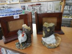 A pair of mahogany photograph frame bookends and a pair of resin chicken bookends