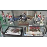 7 soldier figures and a selection of books on soldiers, model soldiers etc.