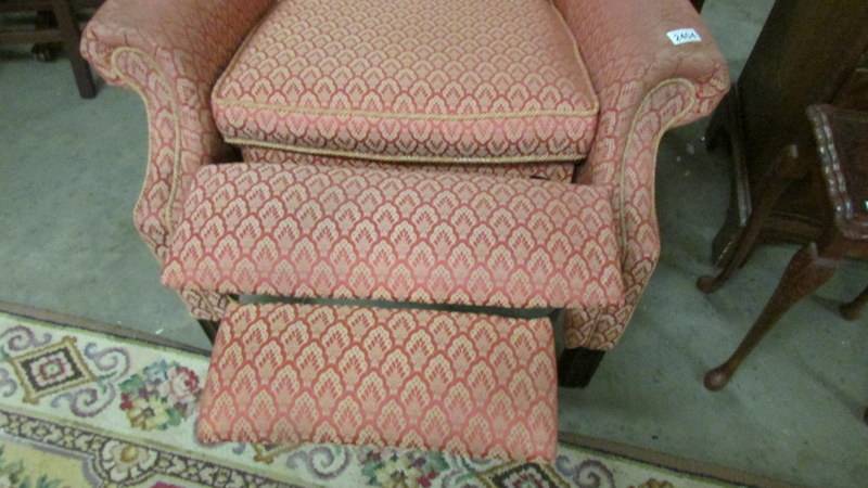 A fully reclining wing arm chair, in good condition but would benefit from a clean. - Image 2 of 4