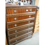 A darkwood stained chest of drawers