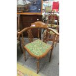 A mahogany inlaid corner chair.