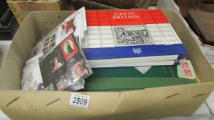 A box of stamps, presentation packs and first day covers etc.