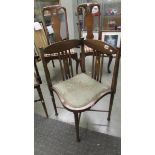 A mahogany inlaid corner chair.