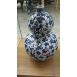 A Chinese blue and white double gourd shaped vase.