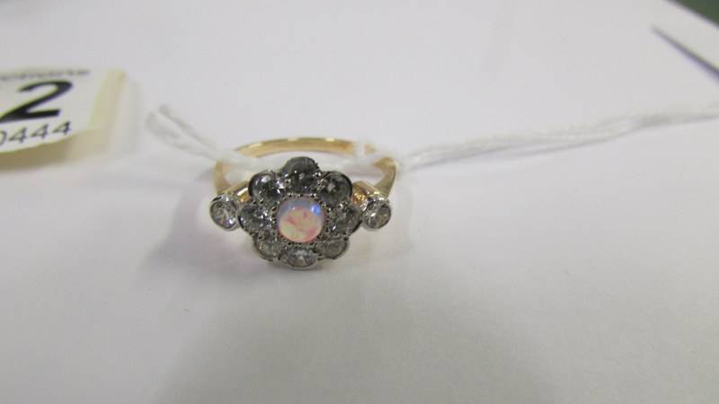 An 18ct gold ring set central opal surrounded by diamonds, size M. - Image 2 of 3