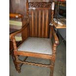 An Edwardian oak carver chair