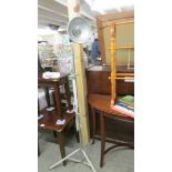 A floor standing adjustable reading lamp.