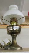 A brass oil lamp.