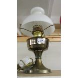 A brass oil lamp.