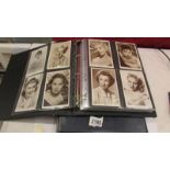 Two albums of female movie star postcards including Grace Kelly, Marilyn Monroe,