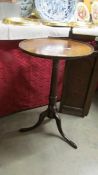 A Victorian mahogany tripod wine table.