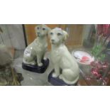 A pair of pottery dogs.