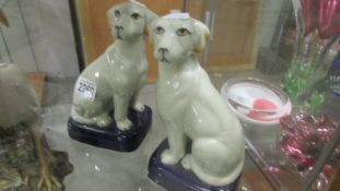 A pair of pottery dogs.