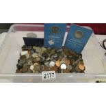 A large quantity of pre decimal UK and foreign coins.