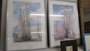 A pair of framed and glazed Sagrada Familia prints.