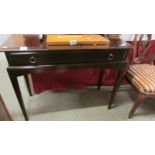 A mahogany single drawer side table.