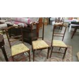 A pair of mahogany inlaid bedroom chairs and one other.