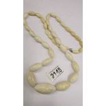 An antique ivory necklace, re-threaded, largest bead a/f, length 97cm (38"), weight 160 grams.