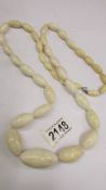 An antique ivory necklace, re-threaded, largest bead a/f, length 97cm (38"), weight 160 grams.