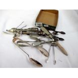A quantity of silver plated sugar tongs and spoons