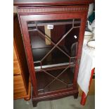 A darkwood stained cabinet