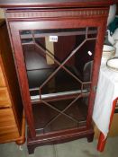 A darkwood stained cabinet