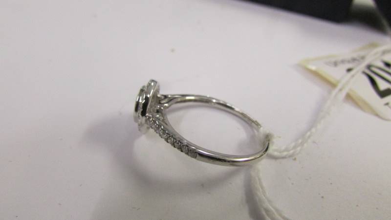 A white gold circular diamond ring of approximately half carat, size P. - Image 3 of 3