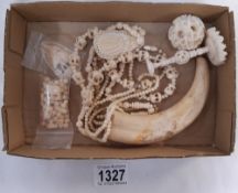 A quantity of bone necklaces etc.