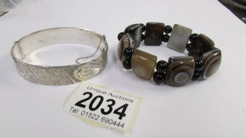 A banded agate stone set vintage bracelet together with a circa 1970's textured design silver