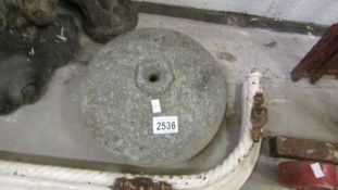 An old curling stone (missing handle).