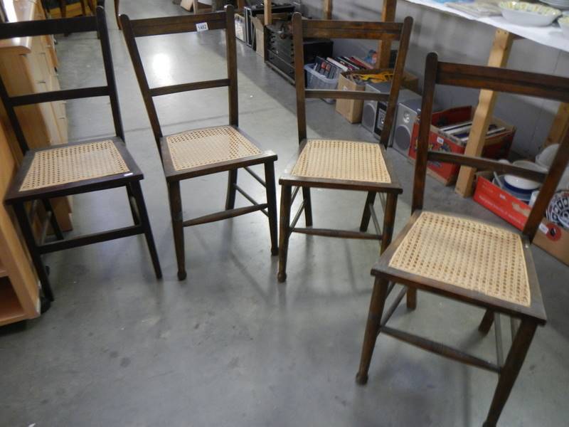 A set of 4 Edwardian chairs wirh reed seat panels