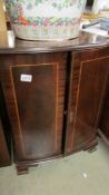 A 2 door mahogany cabinet.