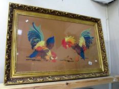 A large gilt framed and glazed wool work of cockerels cock fighting - Collect only