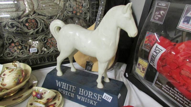 A large White Horse Scotch Whisky advertising horse.