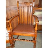 An Edwardian oak carver chair