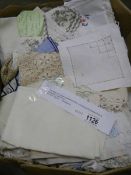 A mixed lot of vintage household textiles including embroidered linens, table cloths, napkins etc.